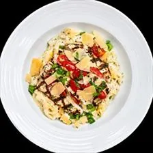 Chicken Fettuccine Alfredo with grilled chicken, grape tomatoes, scallions, and shaved parmesan at BLVD Grille