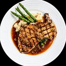 Grilled Chicken Marsala with mushroom marsala sauce, mashed potatoes, and grilled asparagus at BLVD Grille
