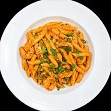 Penne Diavolo with shrimp in spicy tomato cream sauce and scallions at BLVD Grille