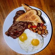 Steak and Eggs with two eggs, breakfast potatoes, and toast at BLVD Grille